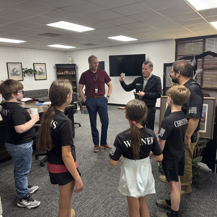 Sro students receiving coins from Dr duff