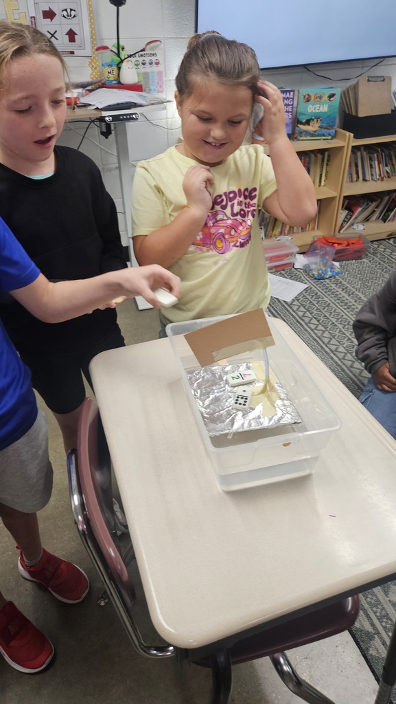 Students building boats