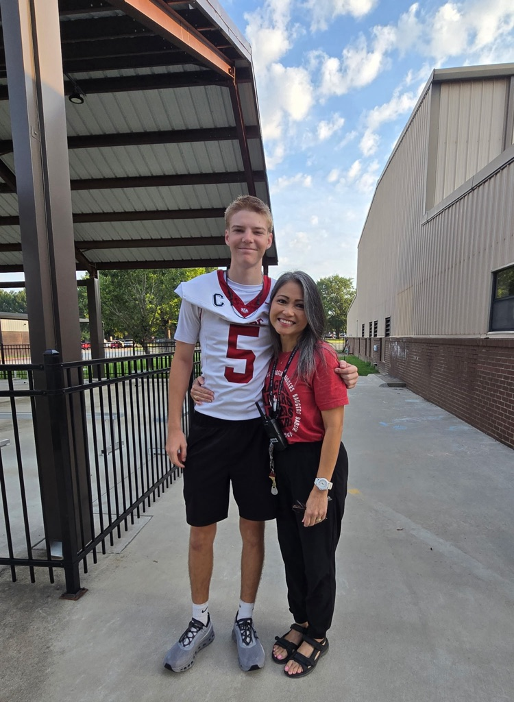 football and cheerleaders with pre-K teacher