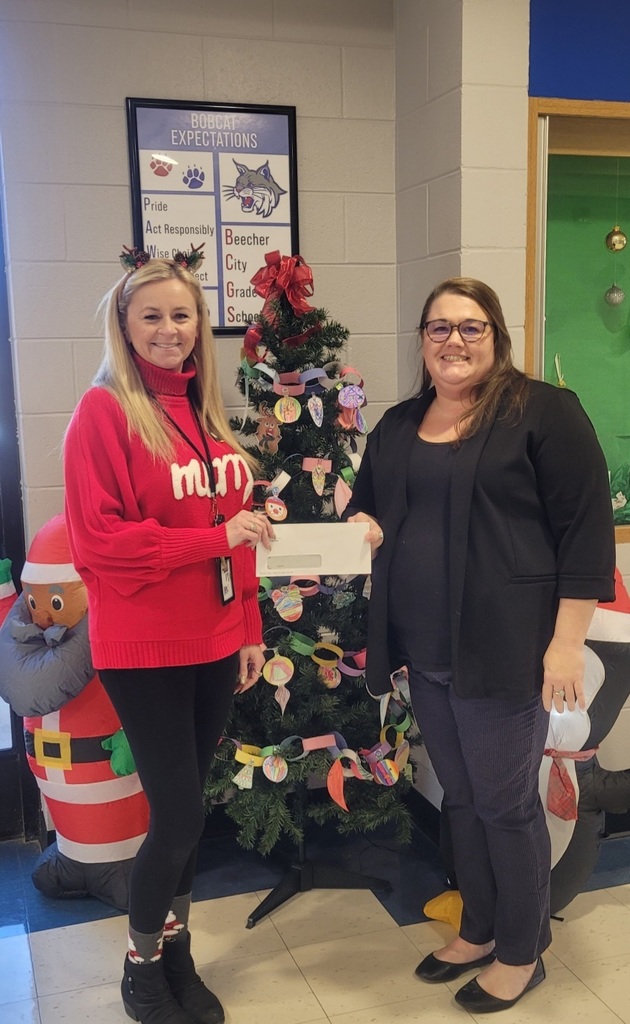 Rebecca from Land of Lincoln Credit Union presenting a check to Beecher City Grade School! Thank you so much!!!