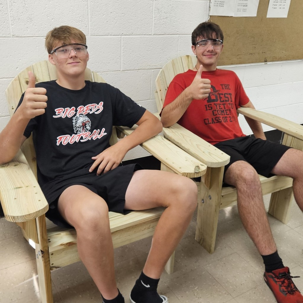 two students in wooden chairs