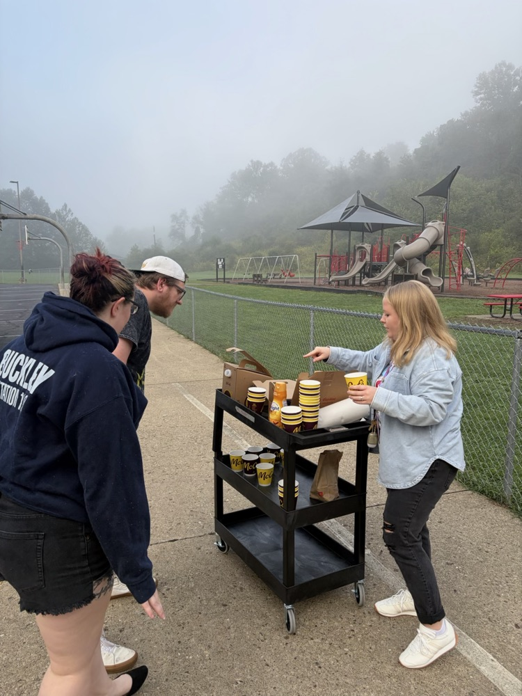 handing out coffee for Attendance month! 