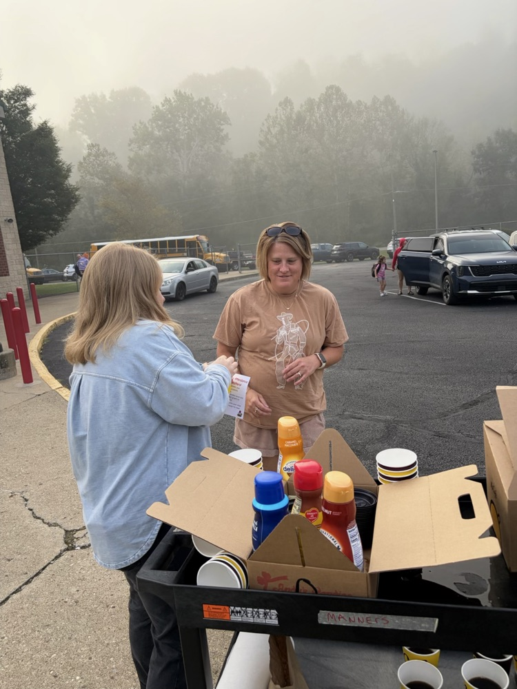 handing out coffee for Attendance month! 