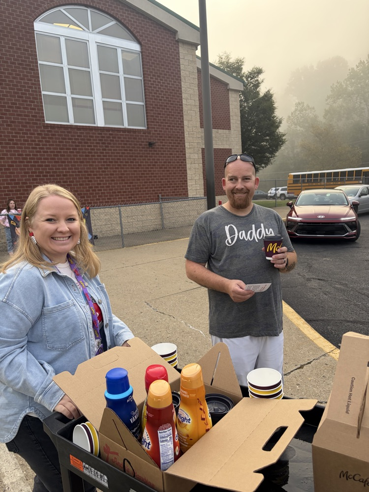handing out coffee for Attendance month! 