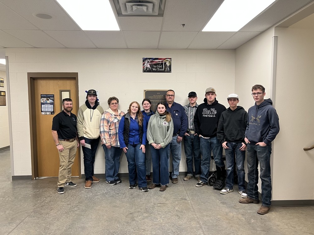 Pictured are Billye and her son, Jace, as well as Mr. Bishop, Mr. Hartwell, and a number of our students taking CTE courses.
