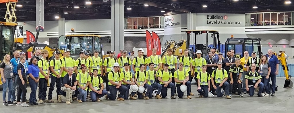 Ryan is in the back row second from the right side of the competitors (guys with yellow shirts).