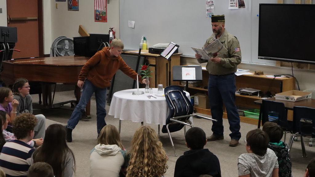 white table with 6th graders