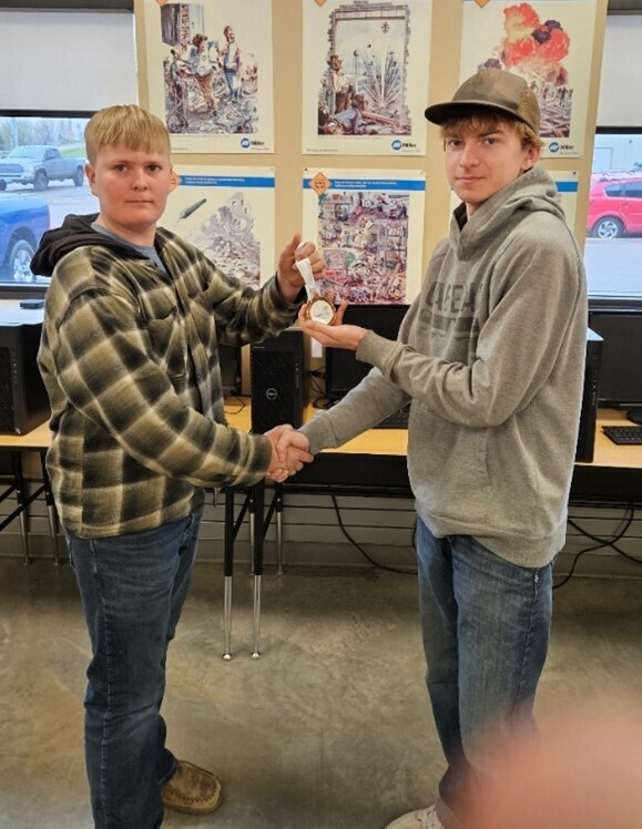 Members Tyler Hendrickson (left) and Landon Tate (right) split 3rd place in the heavy equipment operations skills area.