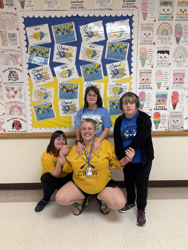 Celebrating Down Syndrome awareness month in style!  Pictured from left to right: Fara Bricker (Freshman), Emma Juelfs (Senior), Sadee Keil (Freshman), and Miss Amanda (MS parapro)