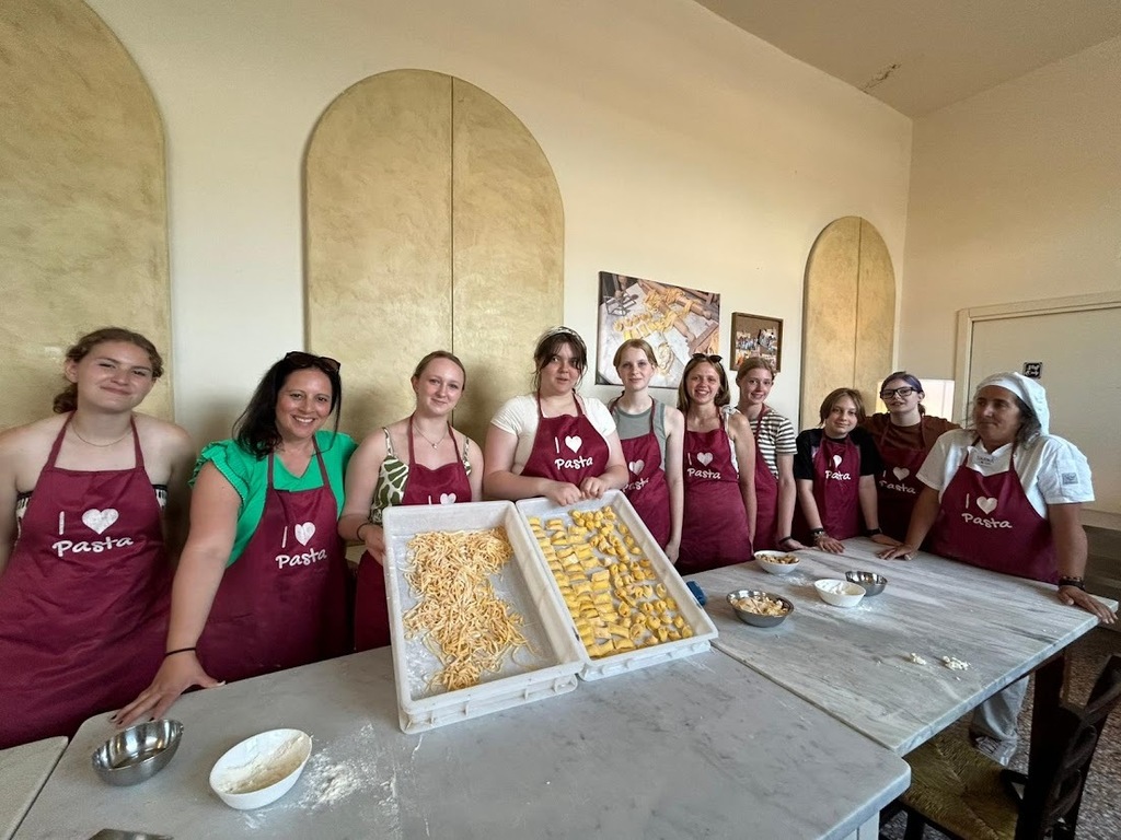 Group cooking pasta.