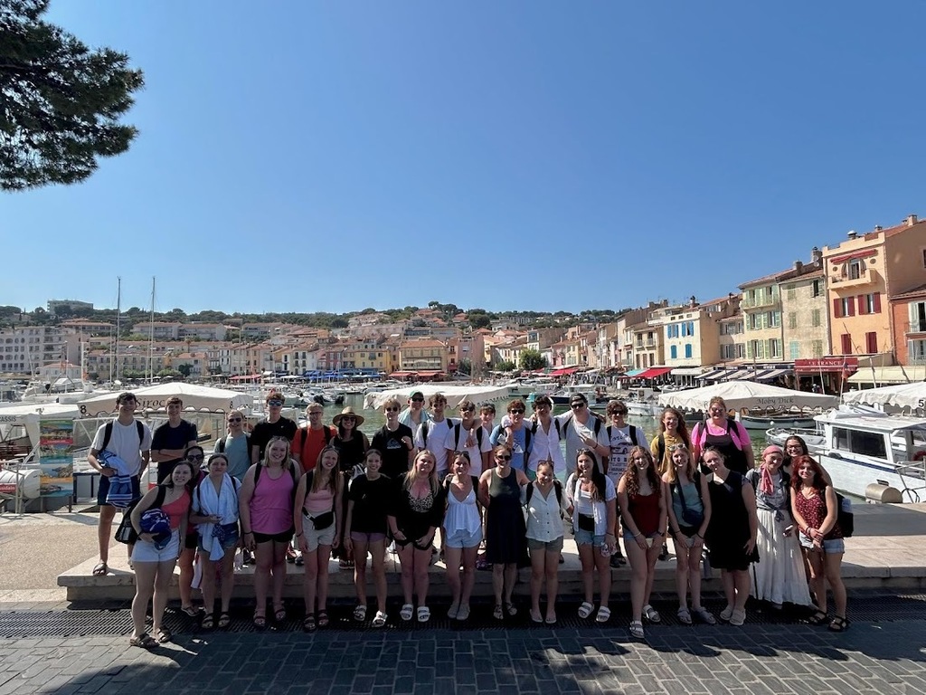 Group in front of many buildings