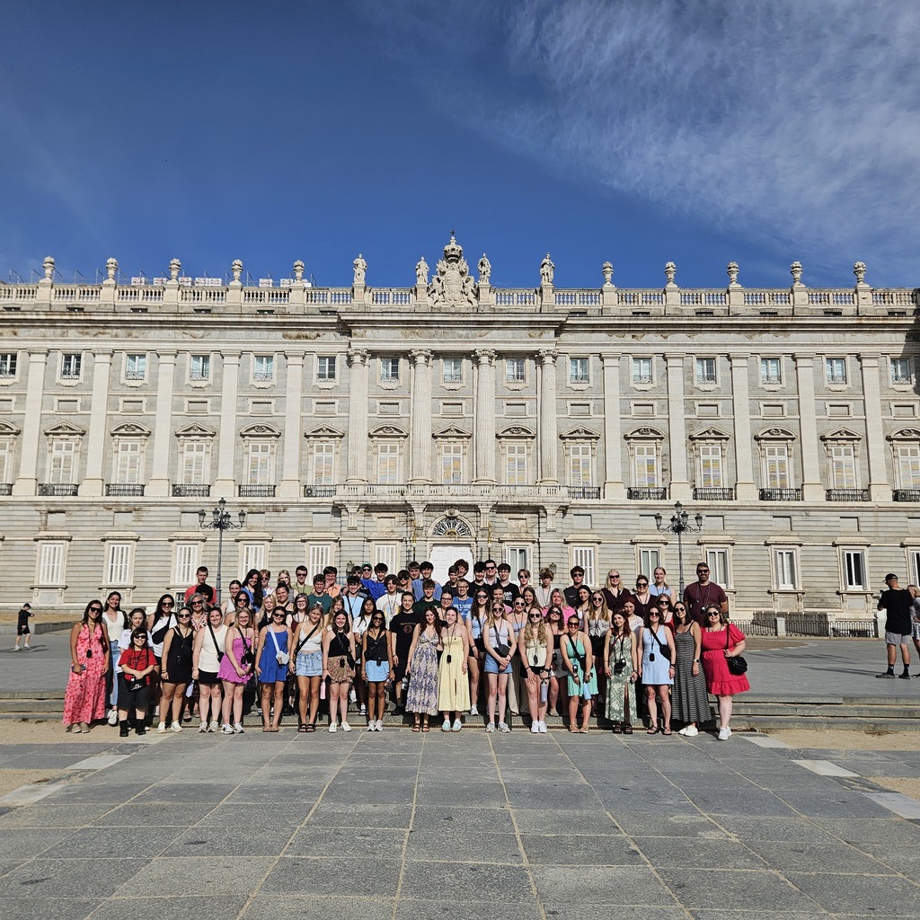 Large group in front of building.