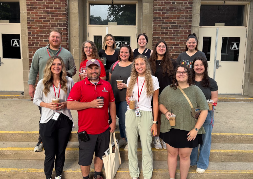 New staff posing with Mr. Maris.