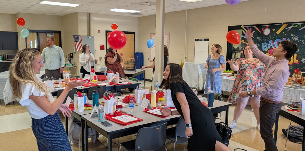 New staff completing in a team building activity.