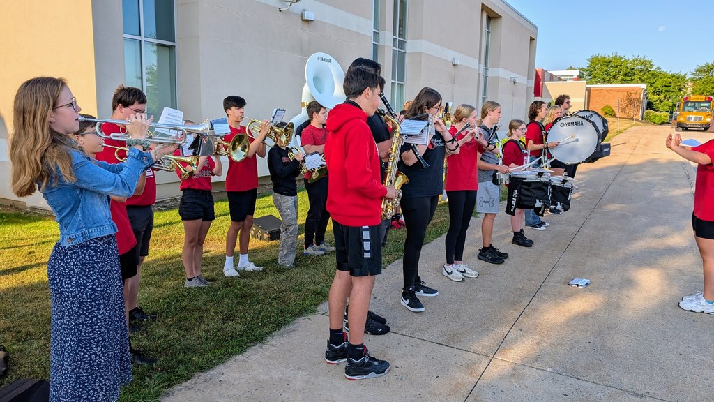 The band performing in front of the theatre.