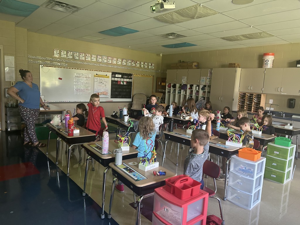 Students in a classroom completing sculptures. 1