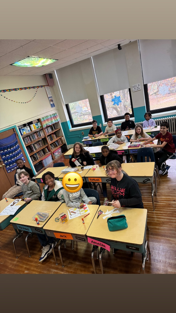 Mr. Ohl’s 3rd grade and Mrs. Sharos’ 6th grade working together to make thankful turkeys.