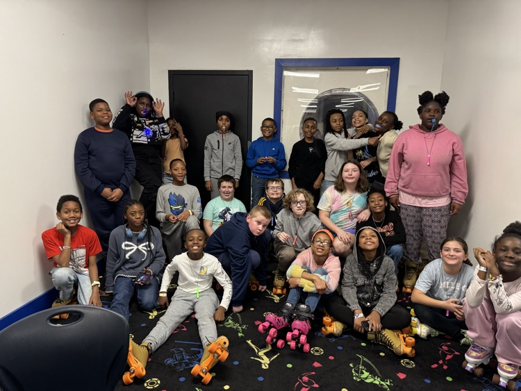 students posing at skate party 