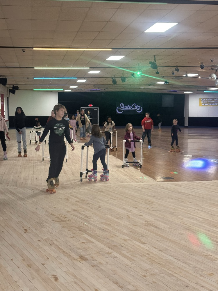 students posing at skate party 
