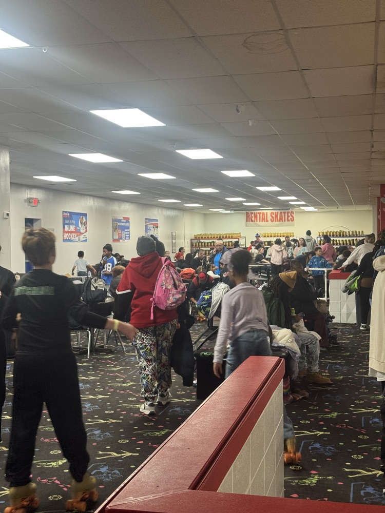 students posing at skate party 