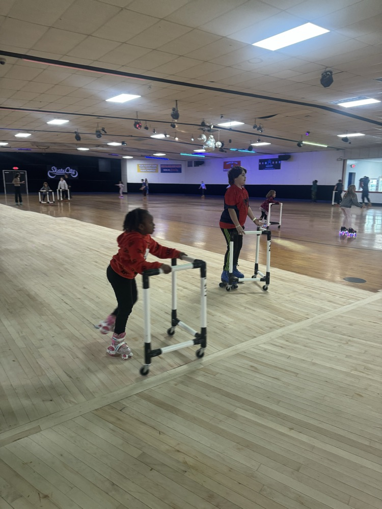 students posing at skate party 