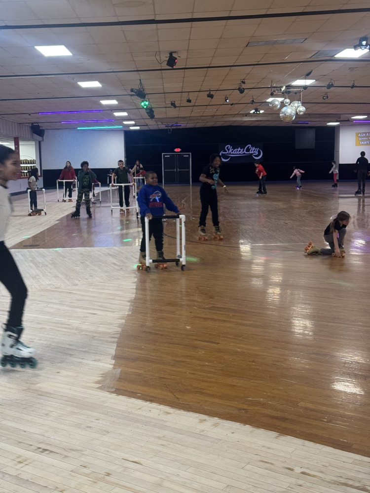 students posing at skate party 