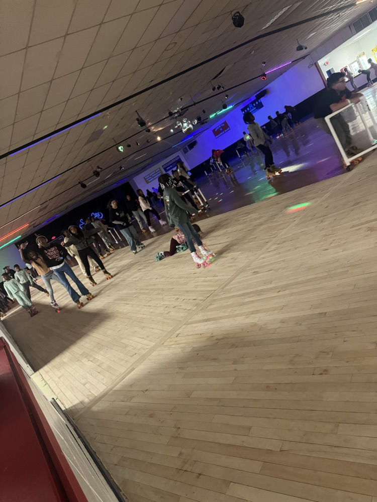 students posing at skate party 