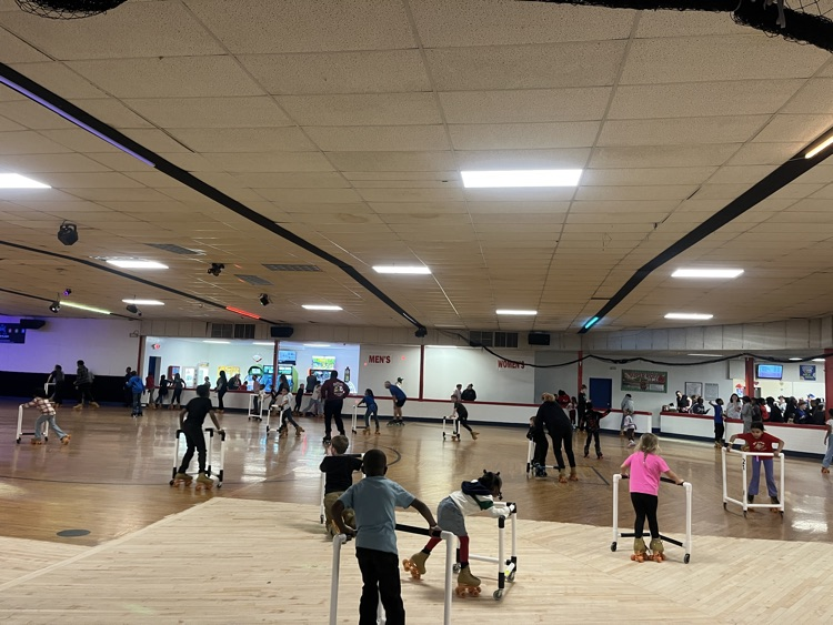 students posing at skate party 