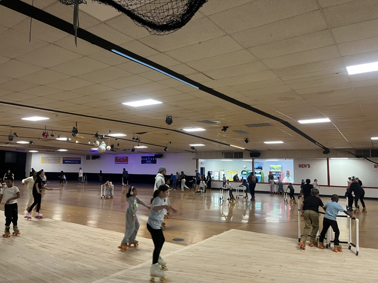 students posing at skate party 