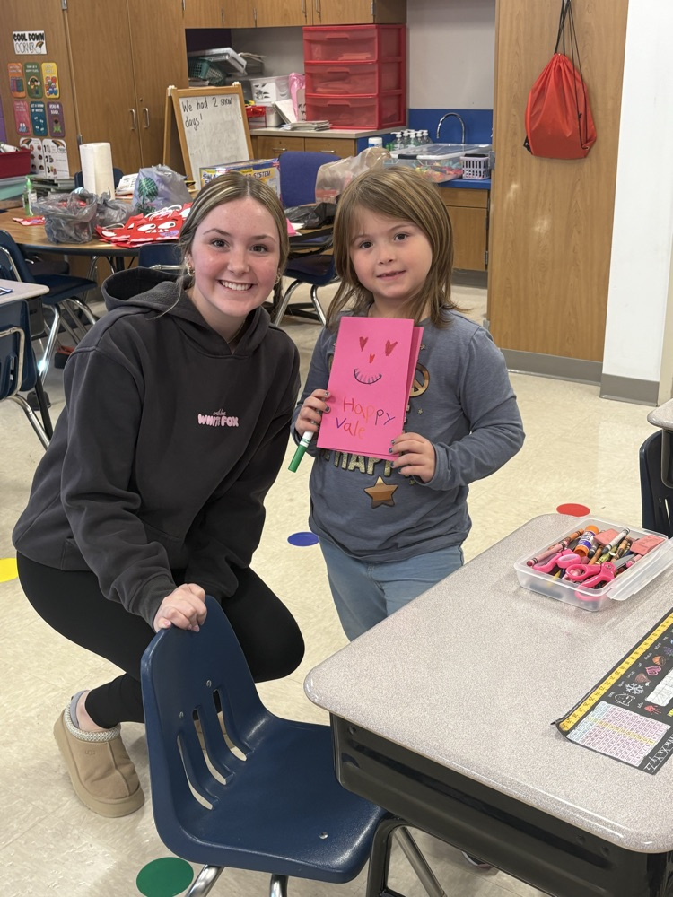 1st grade and high schoolers making Valentines 