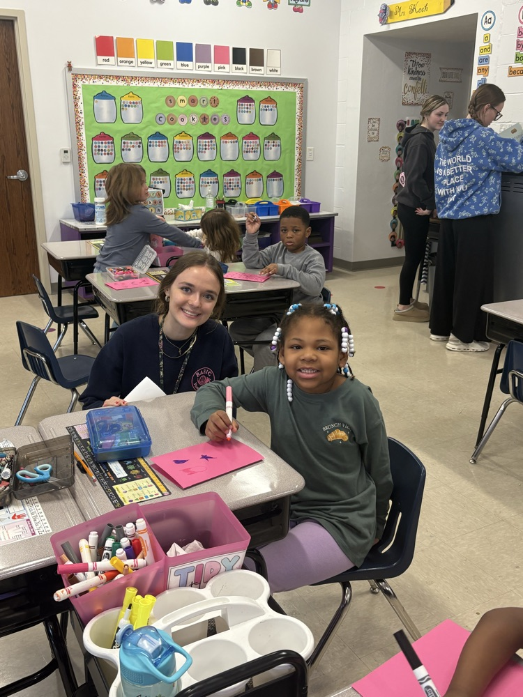 1st grade and high schoolers making Valentines 
