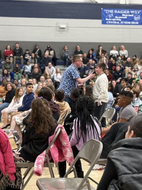 Author talking with student