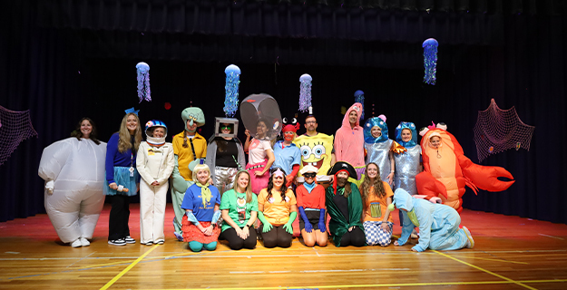 1)	Reinhard Early Childhood Center teachers took on the roles of characters from “SpongeBob SquarePants” at the annual Pep Rally on Oct. 10.