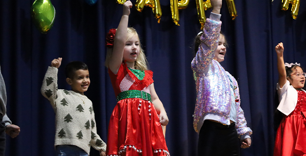Students holding balloons