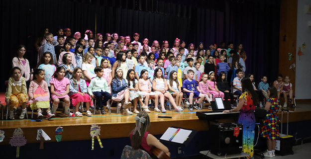 Students performing on stage.