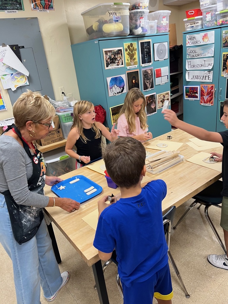 students in classroom doing crafts