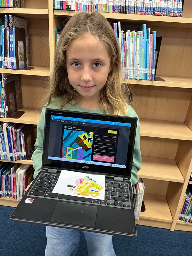 Student holding computer.