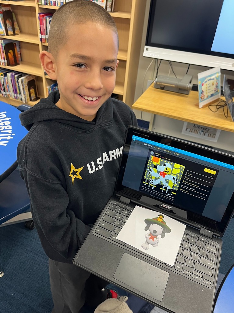 Student holding computer.