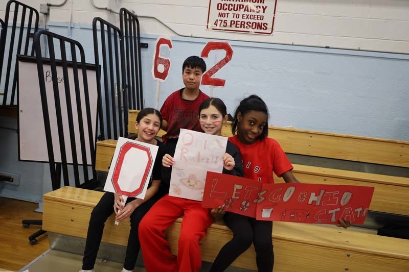 Sporting the colors and logos of different colleges and universities, Shore Road sixth graders faced off for the highly anticipated College Olympics event! Shining Star Leaders were divided into teams that represented different educational institutions and competed in rounds of timed basketball shooting, a fitness relay and volleyball.