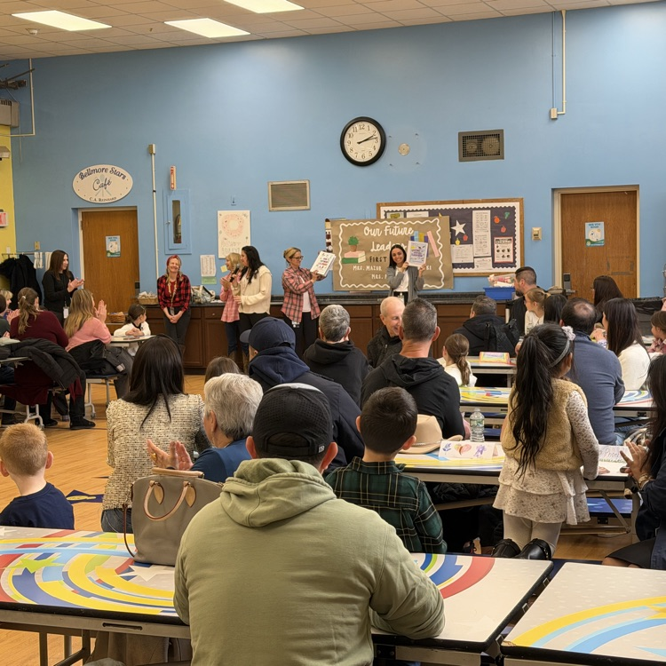 students showing books to parents 