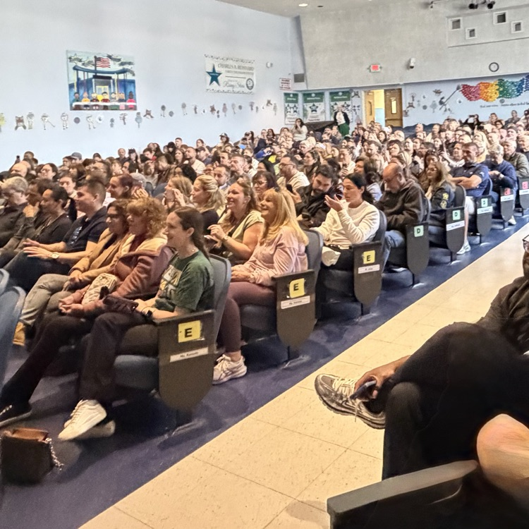 parents watching students on stage 