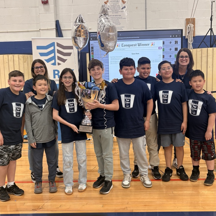 students holding trophy 