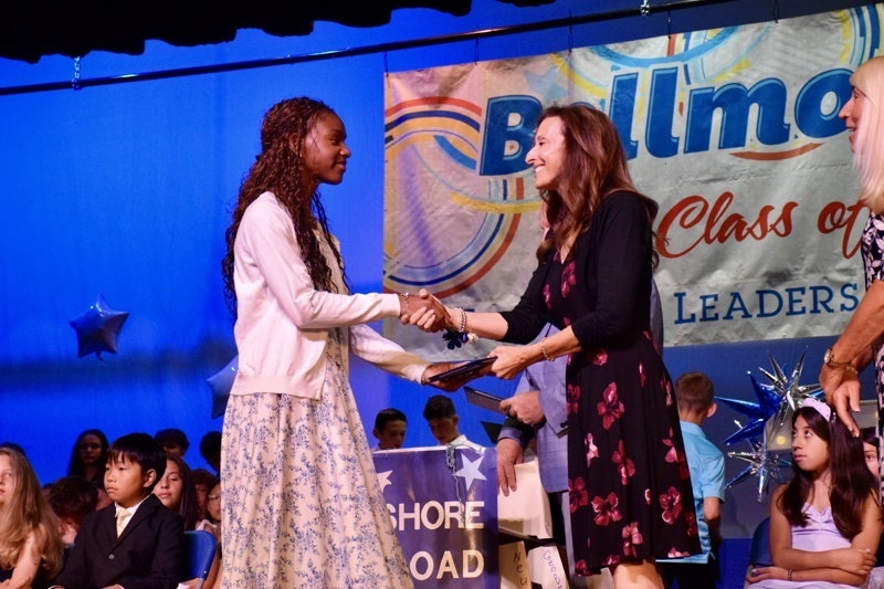 student receiving award on stage