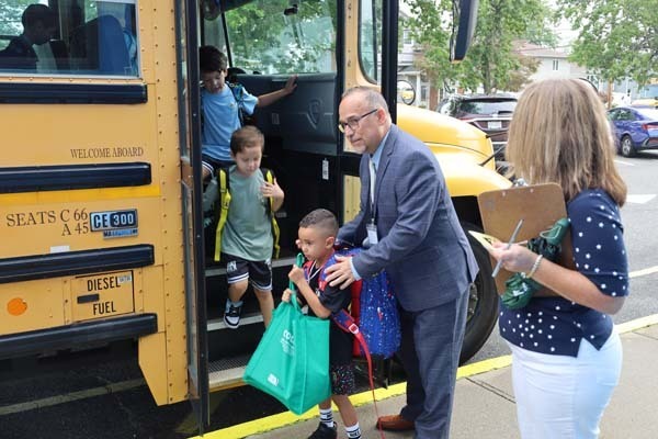 Students Arriving off the bus on the first day of school