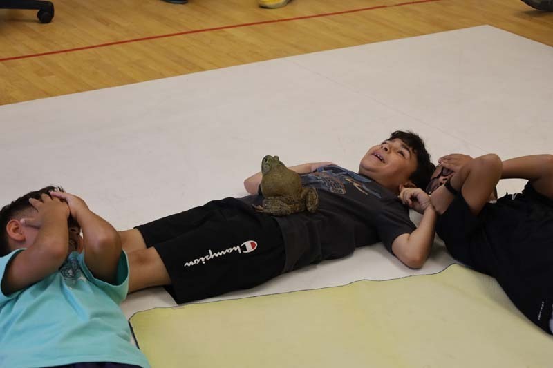 Students laying on the ground.