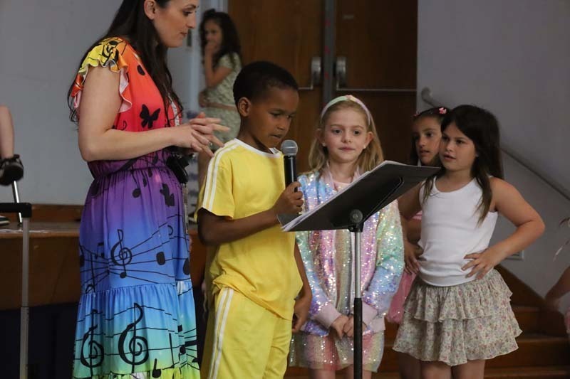 Students performing on stage.
