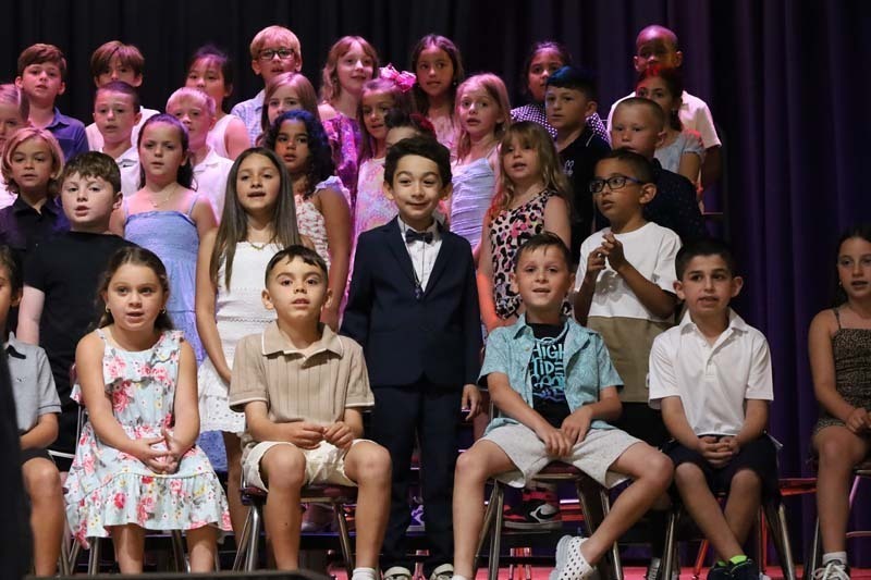 2) Students dressed to impress as parents in the audience cheered.