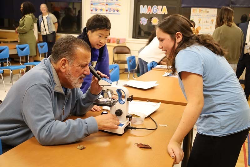 1) Shore Road School sixth graders showed Trustee Maryanne Kelly a hidden microscopic world on Oct. 20.