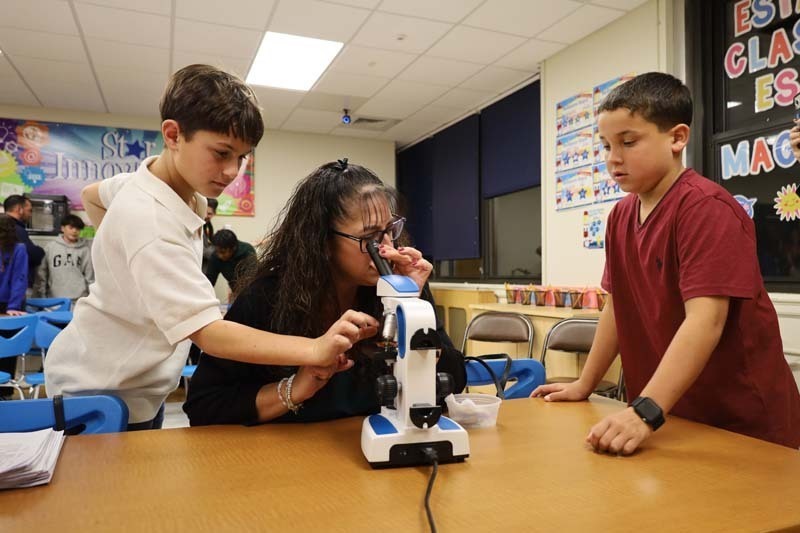 1) Shore Road School sixth graders showed Trustee Maryanne Kelly a hidden microscopic world on Oct. 20.