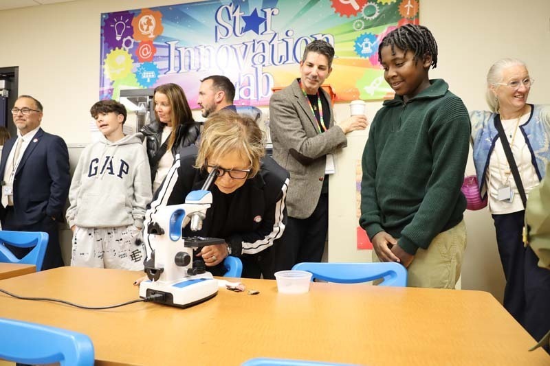 1) Shore Road School sixth graders showed Trustee Maryanne Kelly a hidden microscopic world on Oct. 20.